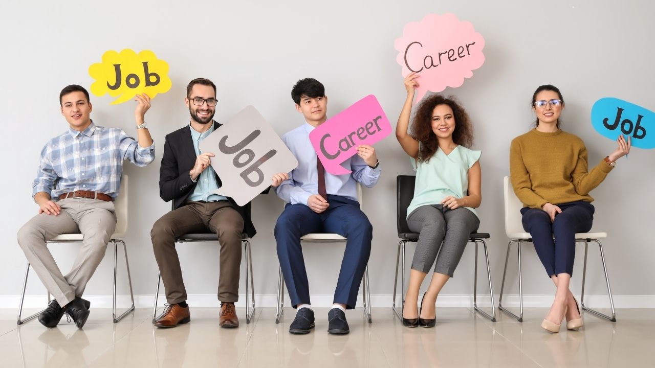 People sitting and holding signs that say "job".
