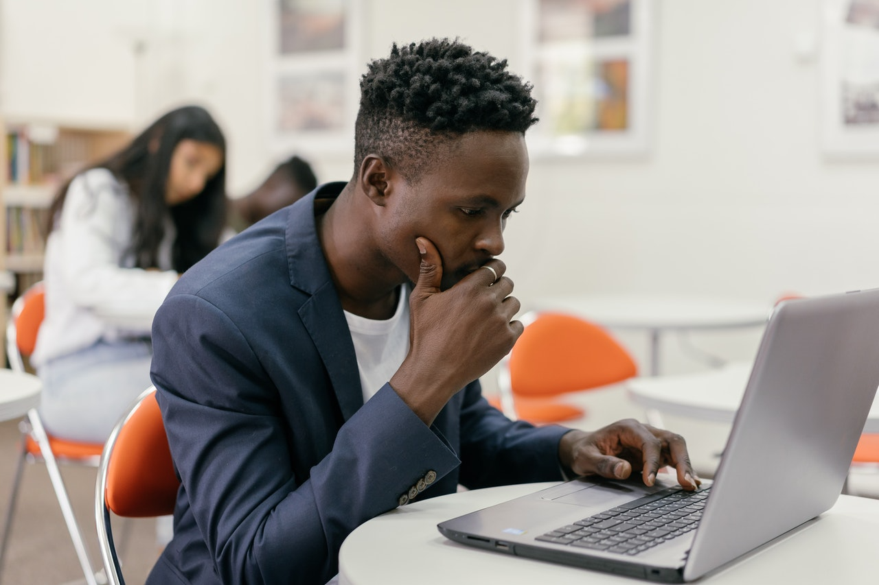 student looking at laptop for career guidance 