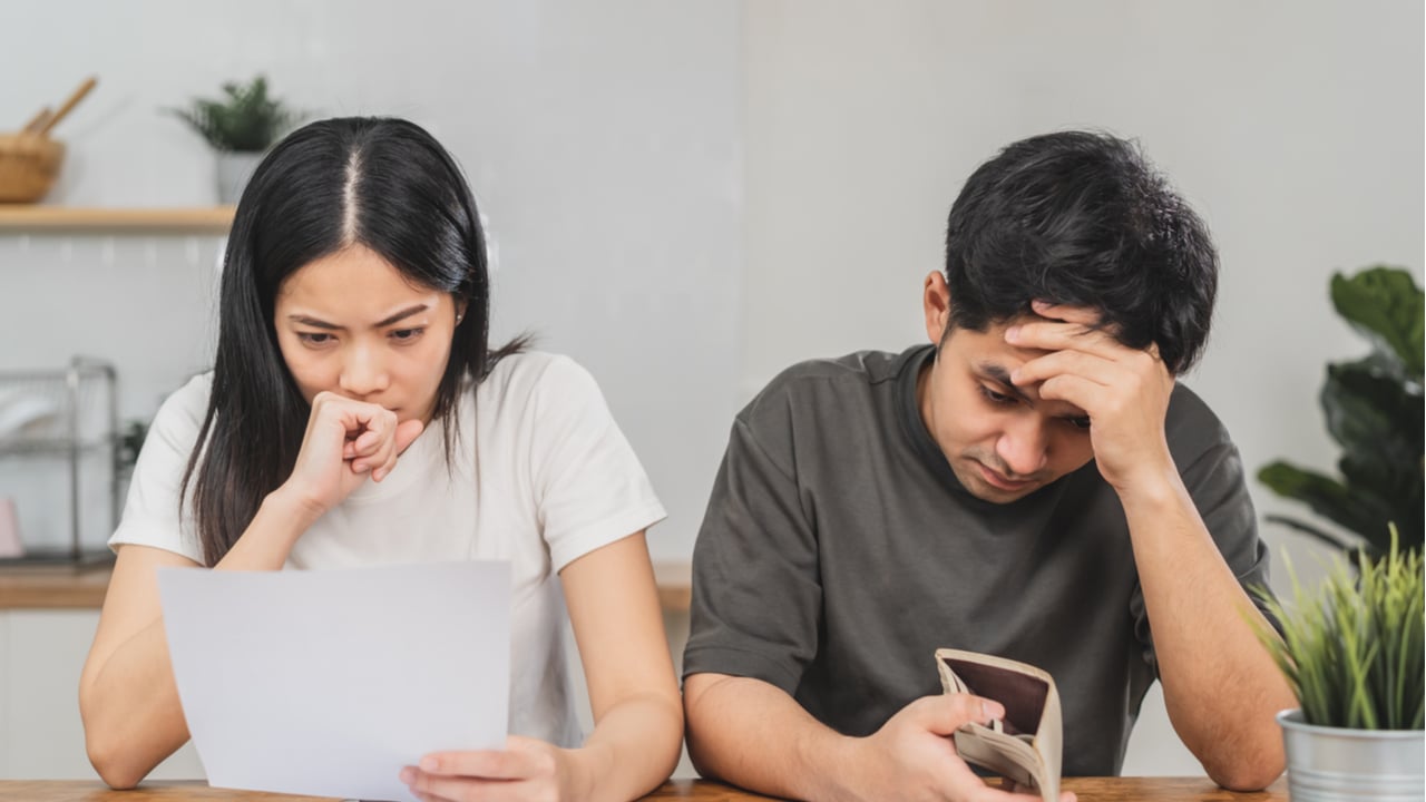 Stressed couple going over bills 