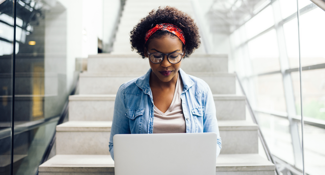 College student on laptop working to map out her career path